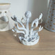 3D printed crystal hand flower jewellery holder in white showing hand holding flower