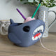 3D printed shark yarn bowl in grey-blue showing open jaw yarn guide and bowl