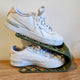 3D printed shoe organizer display in white holding a miniature shoe